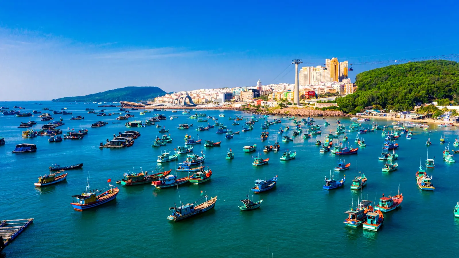 Aerial view of An Thoi fishing harbour packed with colourful wooden boats