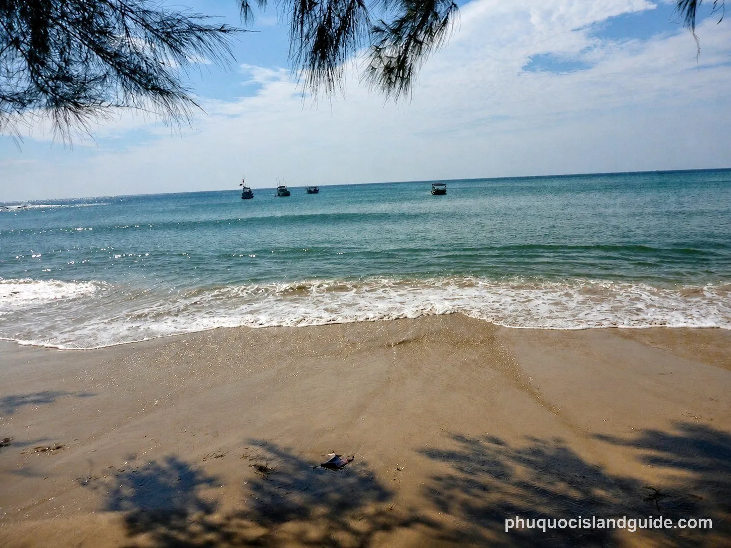 Fishing boats off a sandy beach on the north-west coast