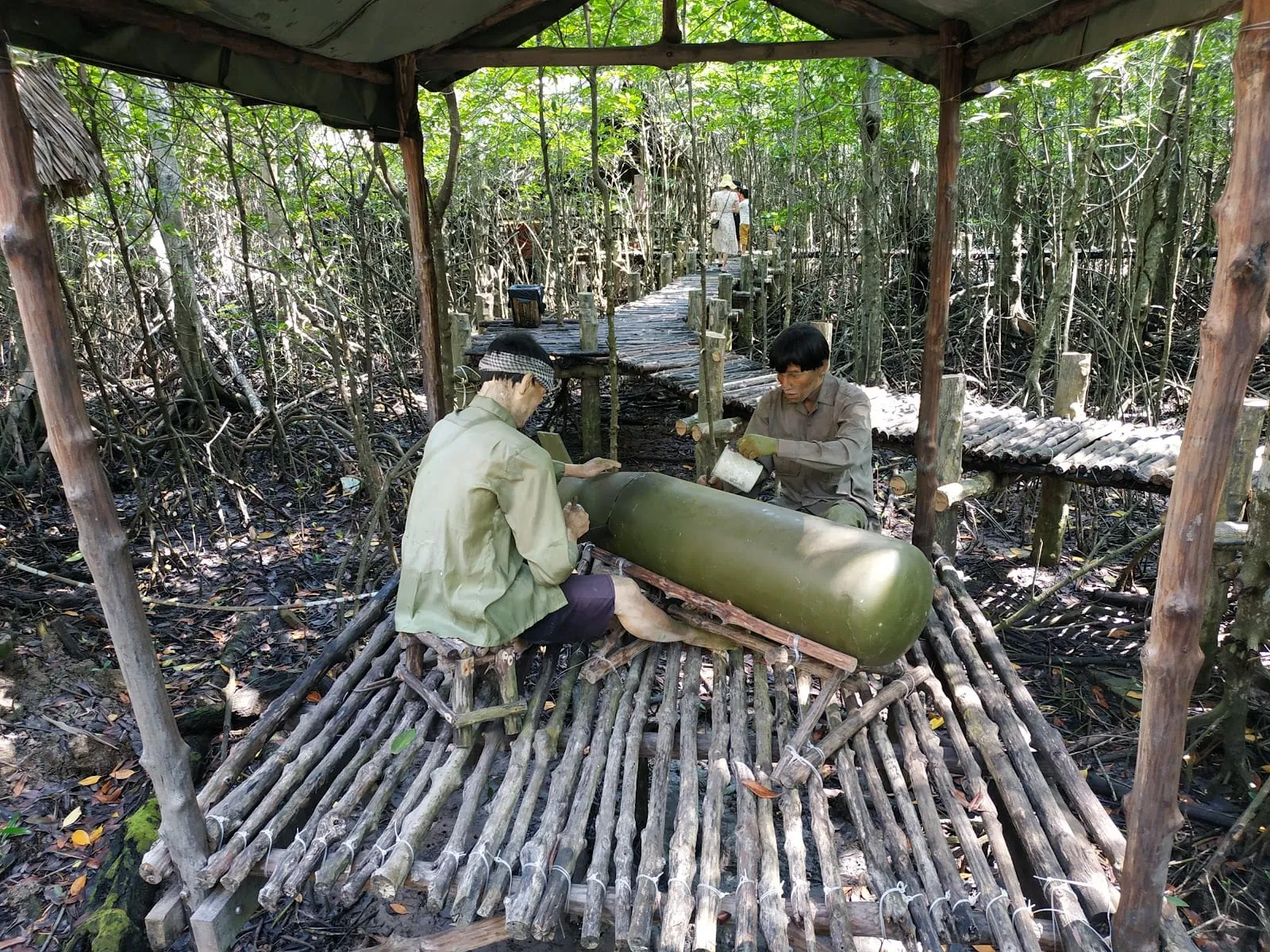 A replica guerrilla camp scene with figures in the mangroves at the Rung Sac base