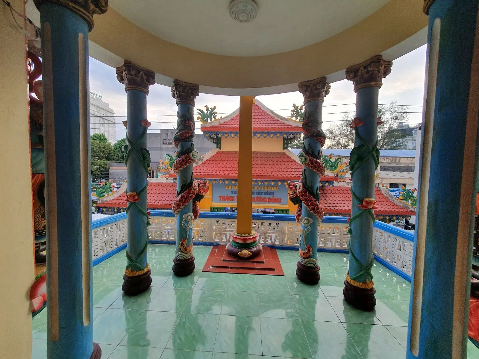 The altar and painted pillars inside the Cao Dai temple in Duong Dong