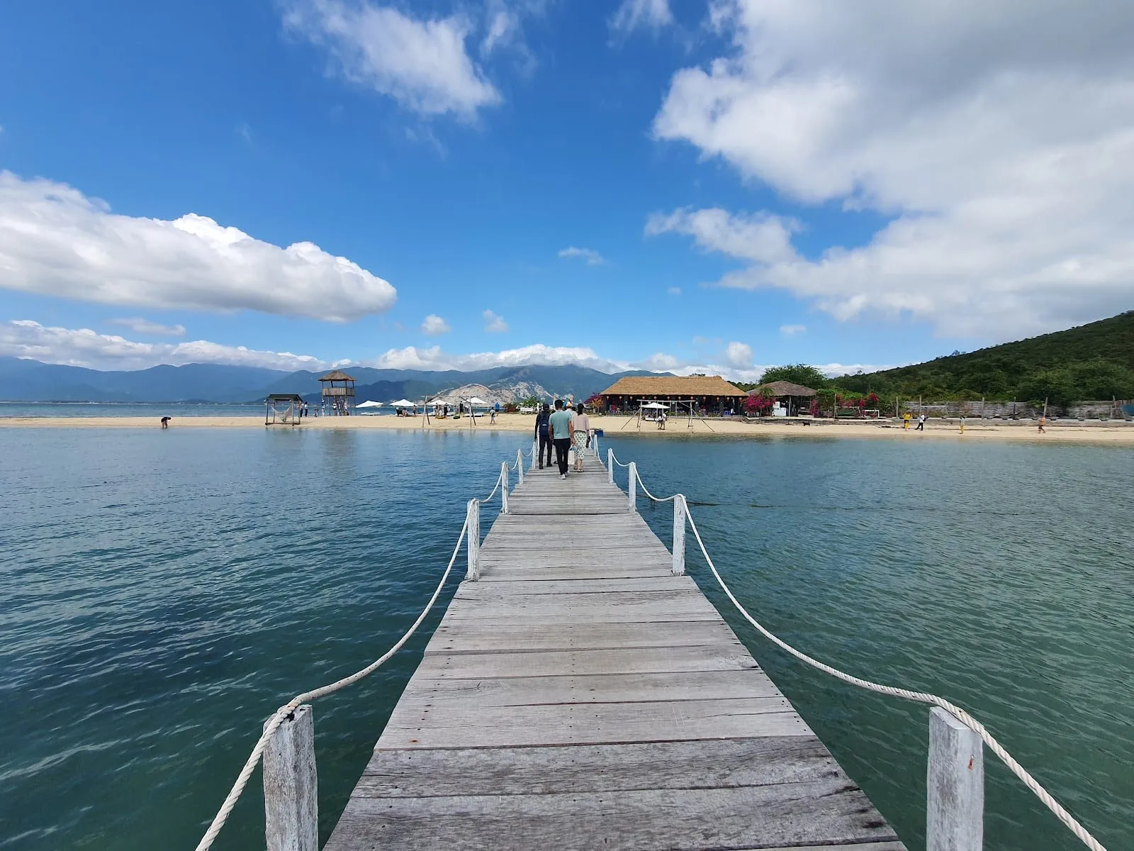 A long wooden jetty leading to the beach on Hon Bip, Diep Son