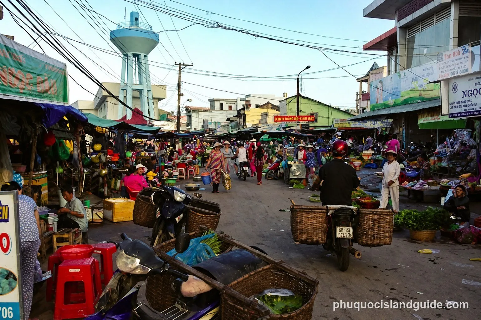 Busy outdoor market in Duong Dong, with stalls and motorbikes