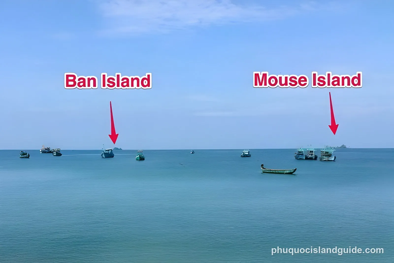 Fishing boats at sea with Ban Island and Mouse Island in the distance