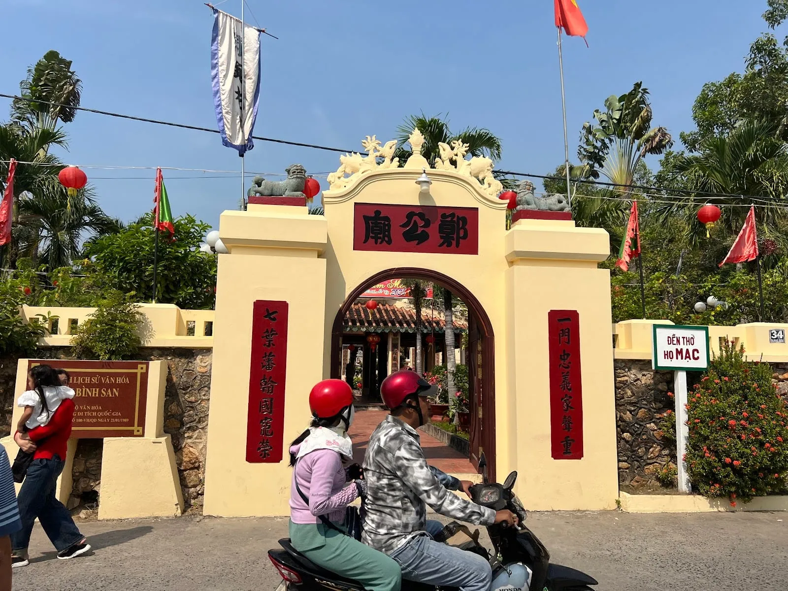 The ornate gate of the Mac Cuu family temple on Binh San hill