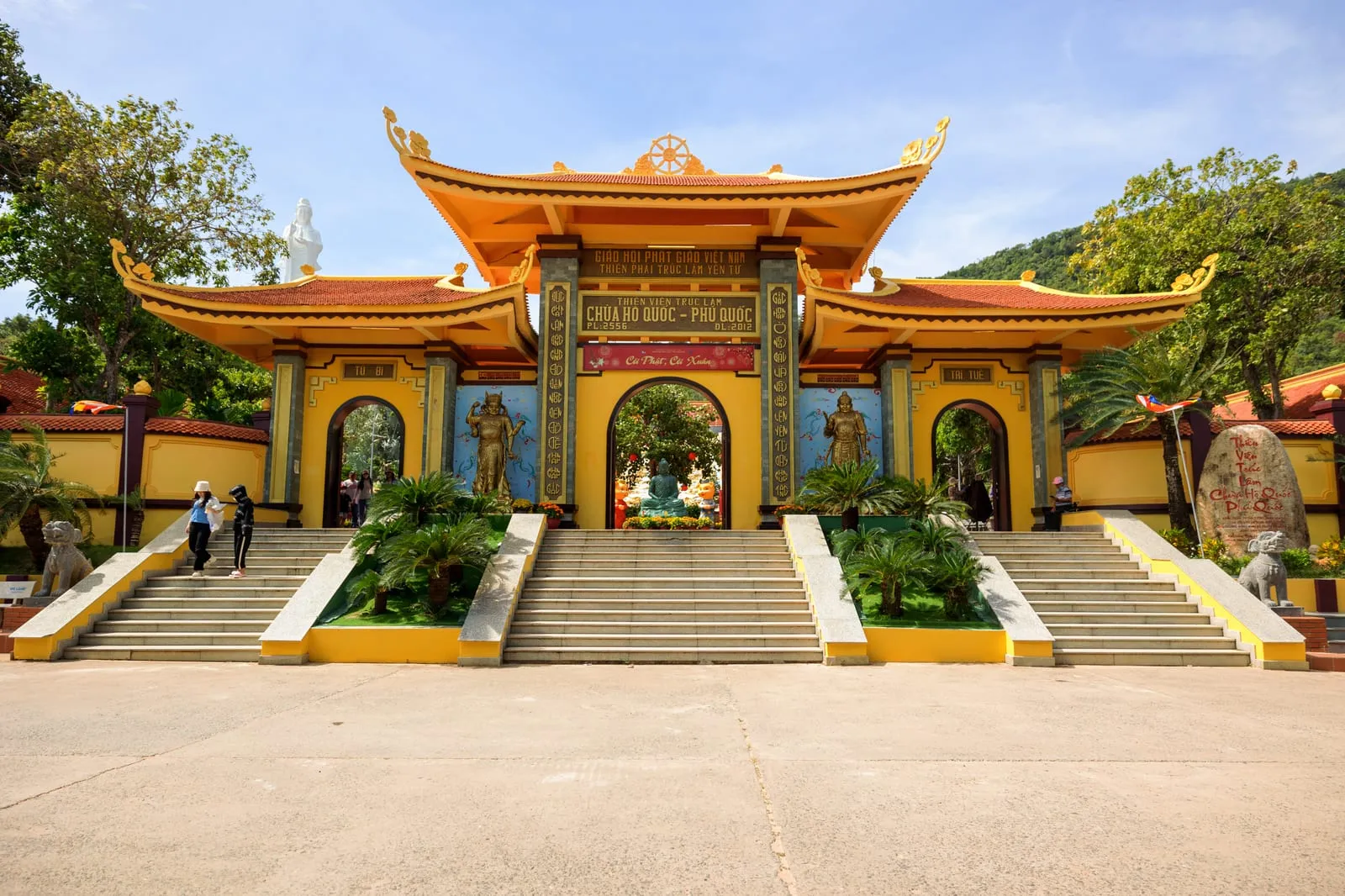 The yellow main gate and steps of Ho Quoc Pagoda