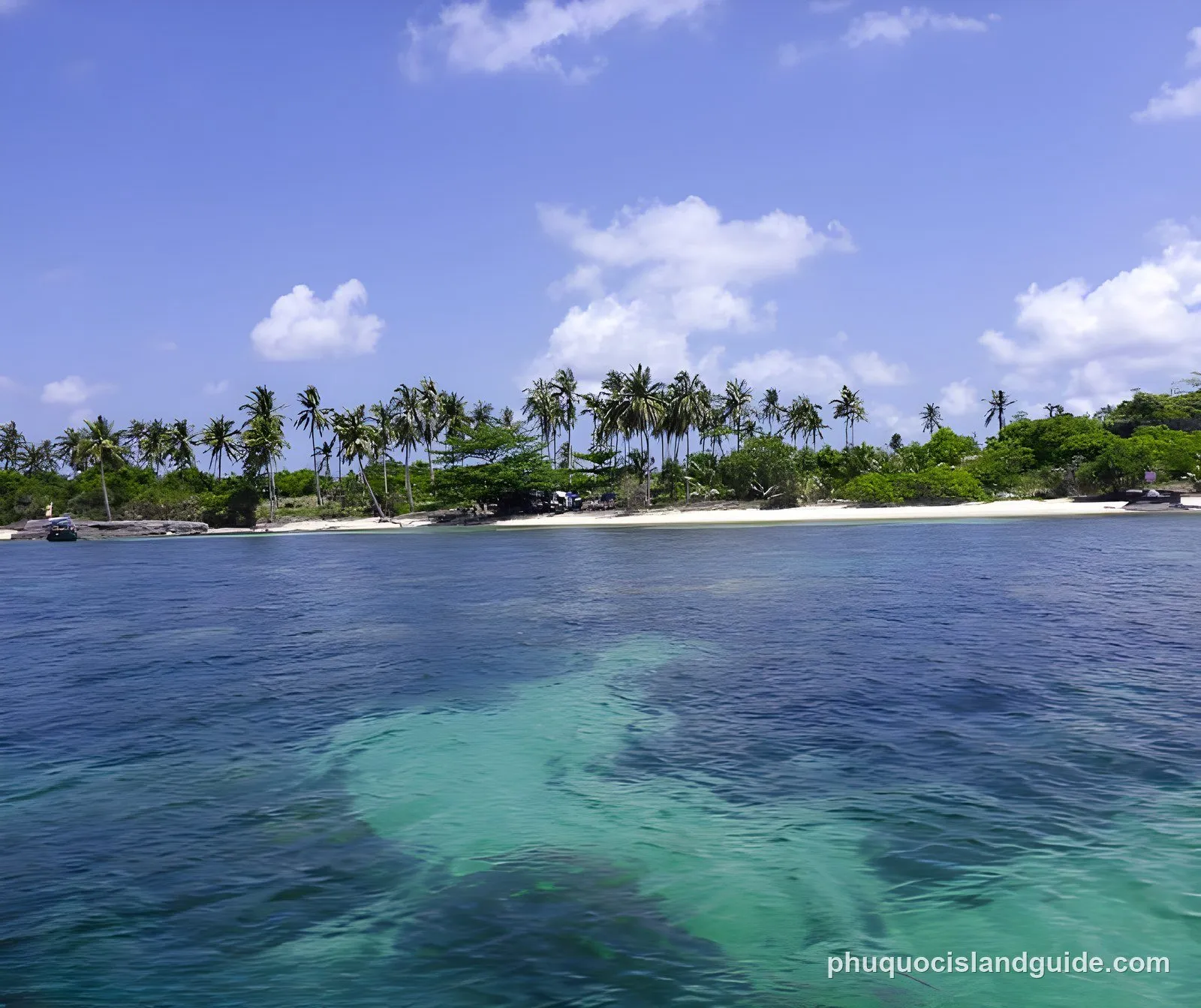 White sand, palm trees and clear water at Hon Gam Ghi