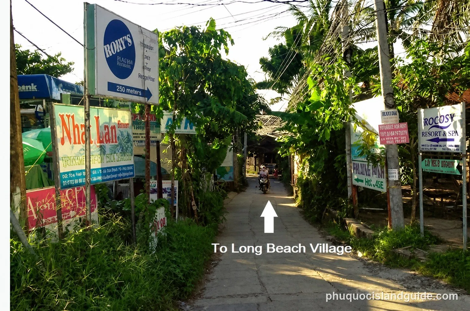 Lane with signs for the resorts of Long Beach Village