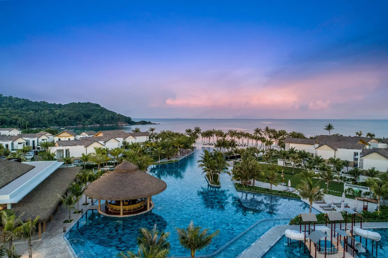 Main pool at New World Phu Quoc Resort at dusk