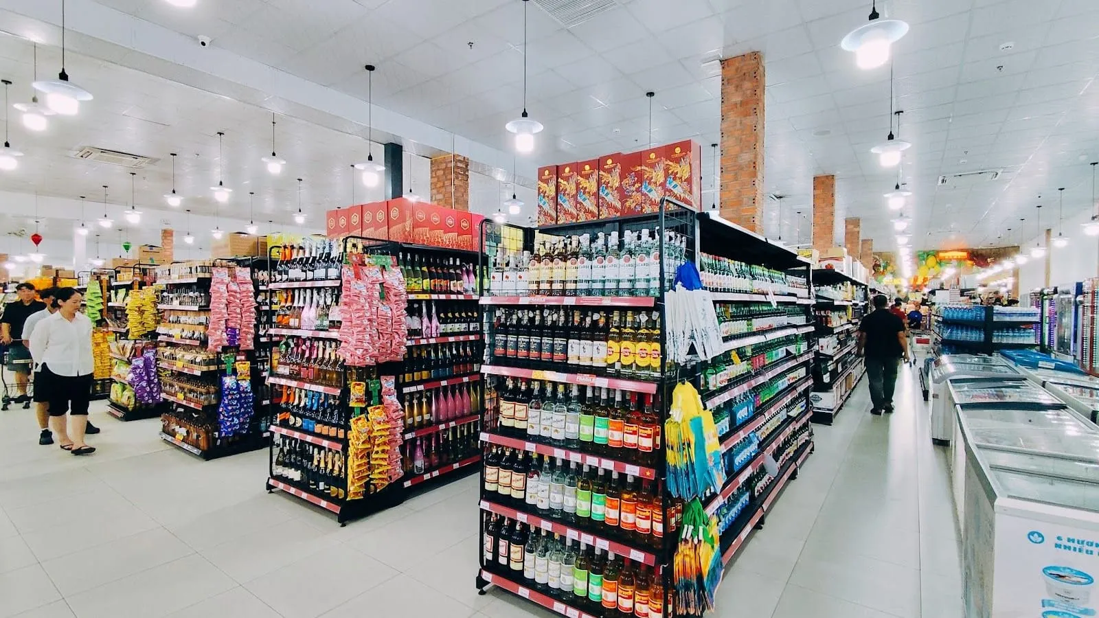 Long, brightly lit aisles of snacks, drinks and souvenirs inside Kingkong Mart supermarket on Phu Quoc