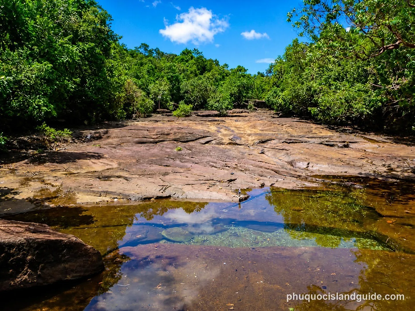 Shallow pools on the flat rock bed of the Da Ban stream