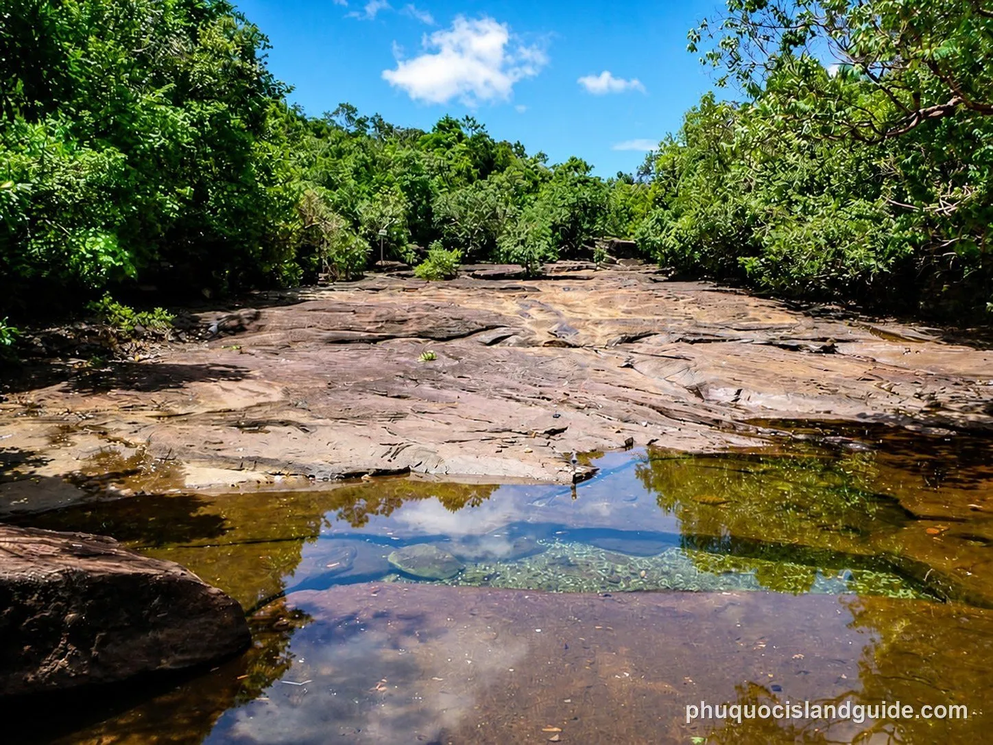 Shallow pools on the flat rock bed of the Da Ban stream