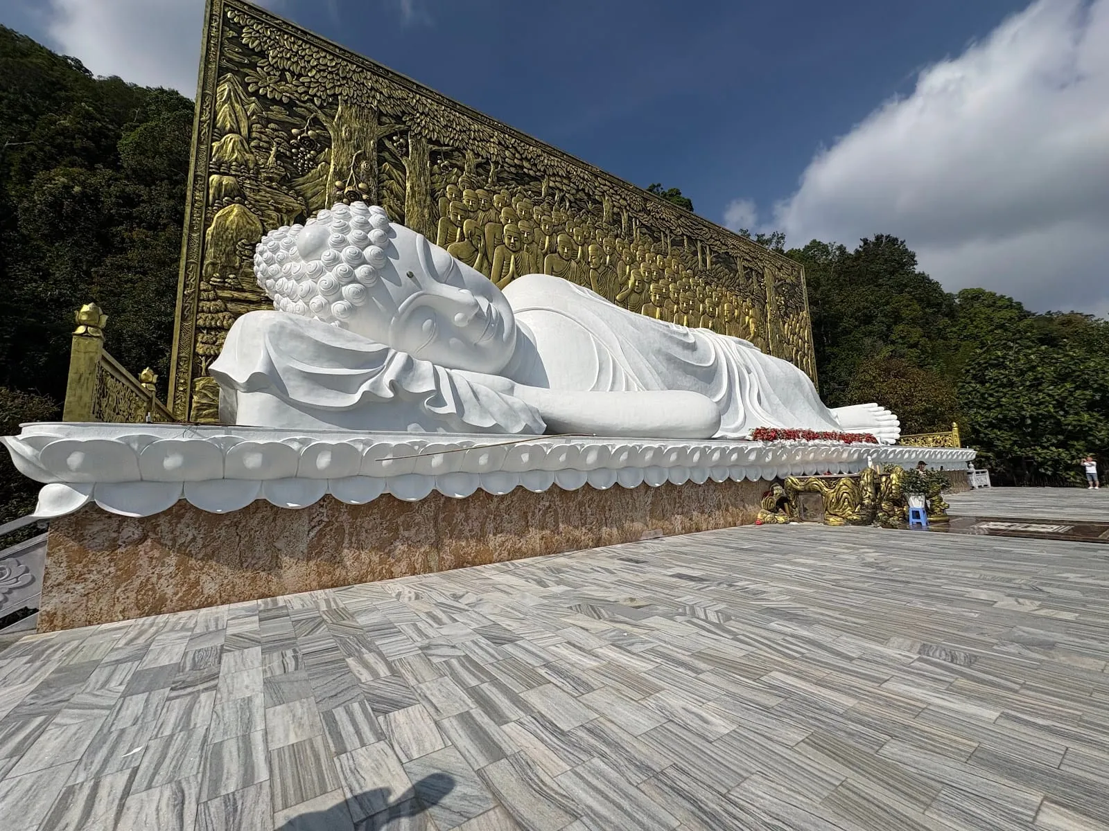 The white reclining Buddha at Su Muon Pagoda, on a terrace below the forest