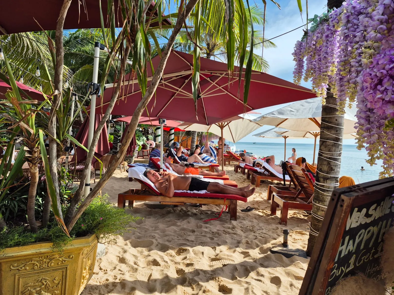 Sunbeds and umbrellas on the beach at Versailles Beach Club
