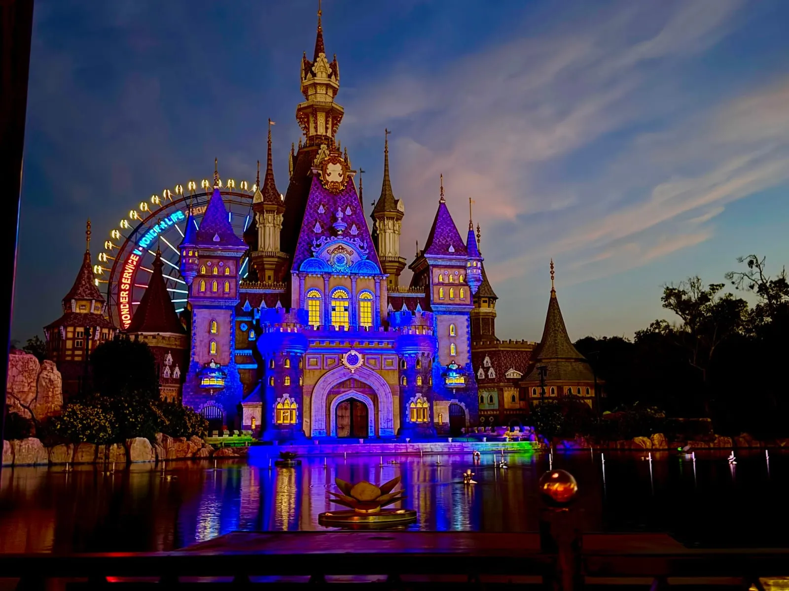 The fairy-tale castle at VinWonders Phu Quoc lit up at night