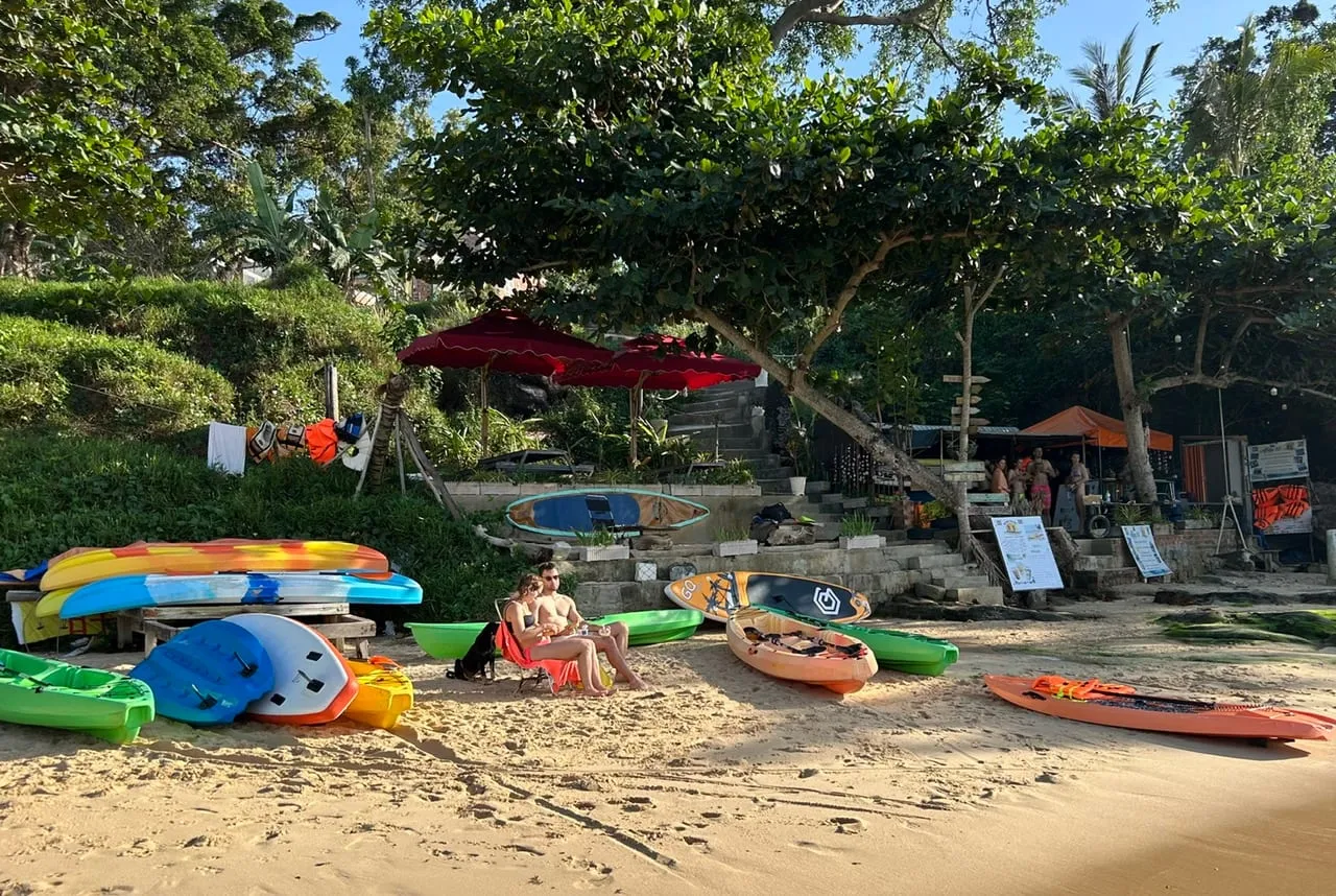 Kayaks and paddleboards on the beach at a kayak club in the north of Phu Quoc